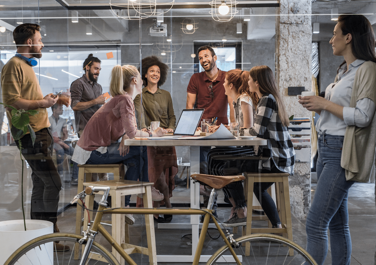 Young colleagues in a meeting with a bike