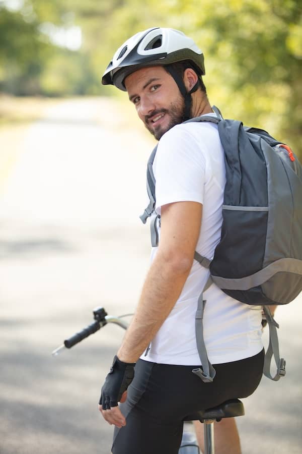 Cyclist with helmet looks around