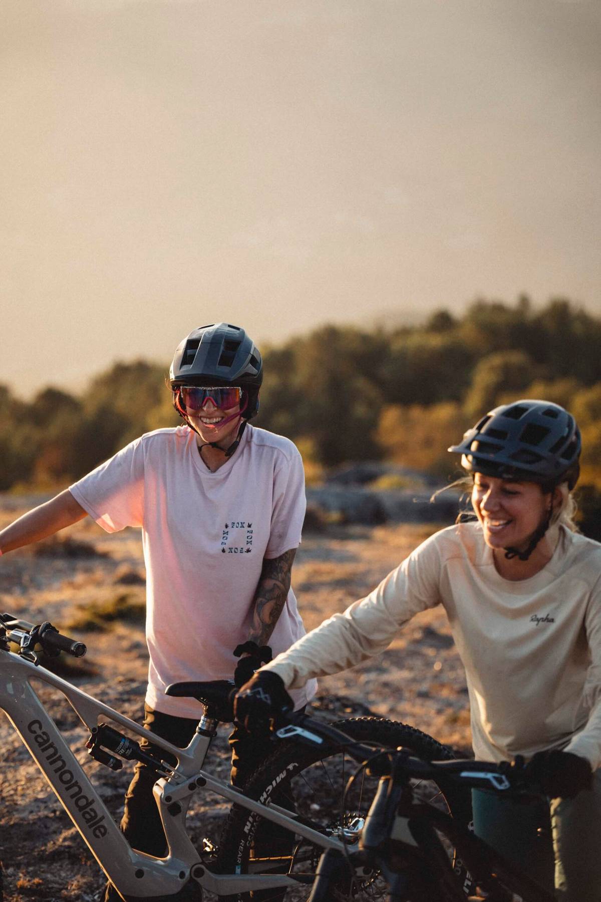 two women with cannondale bikes smiling