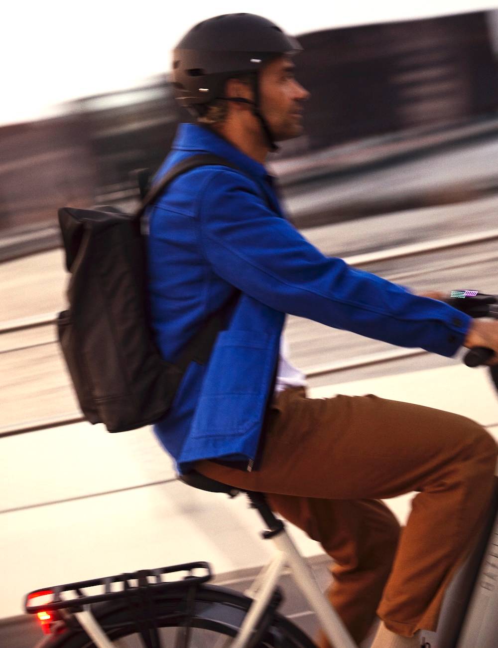 Bicycle helmet on a white bicycle